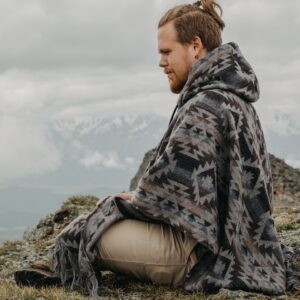 a man sitting on a rock