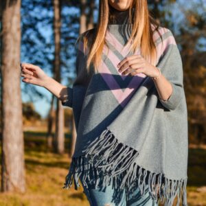 woman standing surrounded by tress